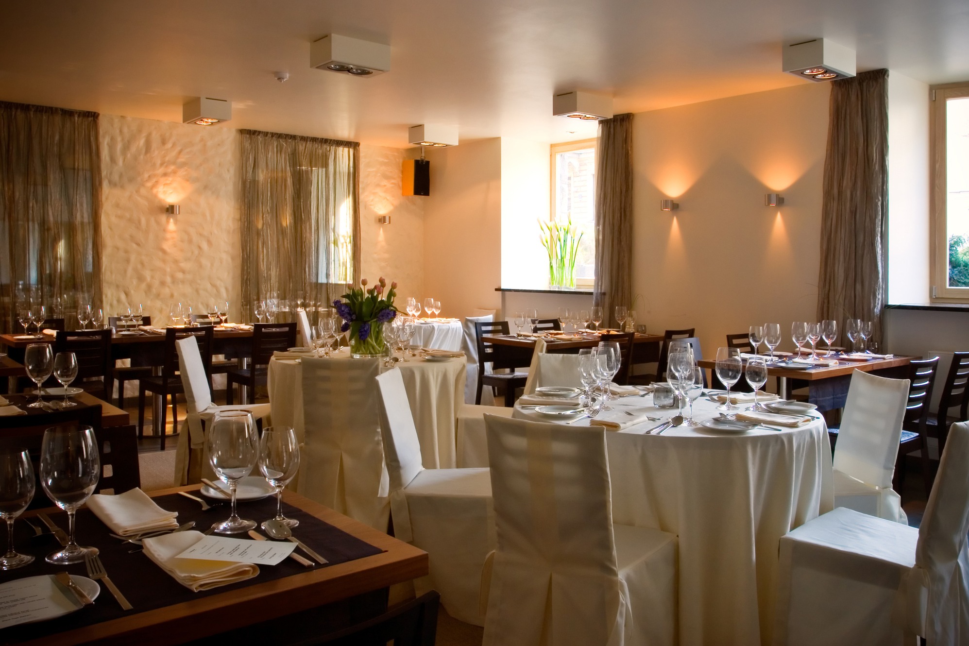 Interior featuring neatly arranged tables and chairs